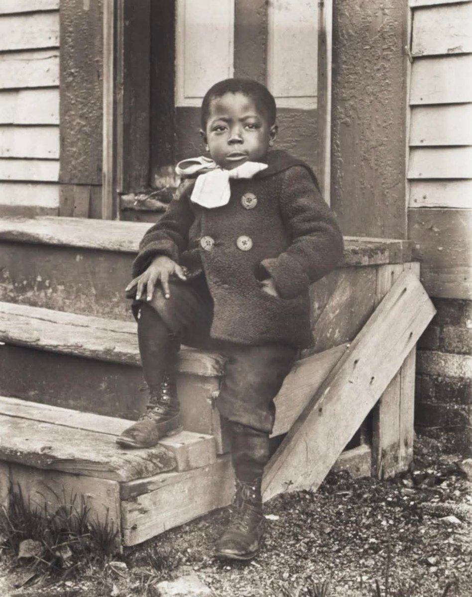 Boy posing proudly in his double breasted winter coat, Worcester, 1902...

For working class families, a well made winter coat was often one of the most expensive possessions a child owned, sometimes purchased to last several years and handed down between siblings.

Early