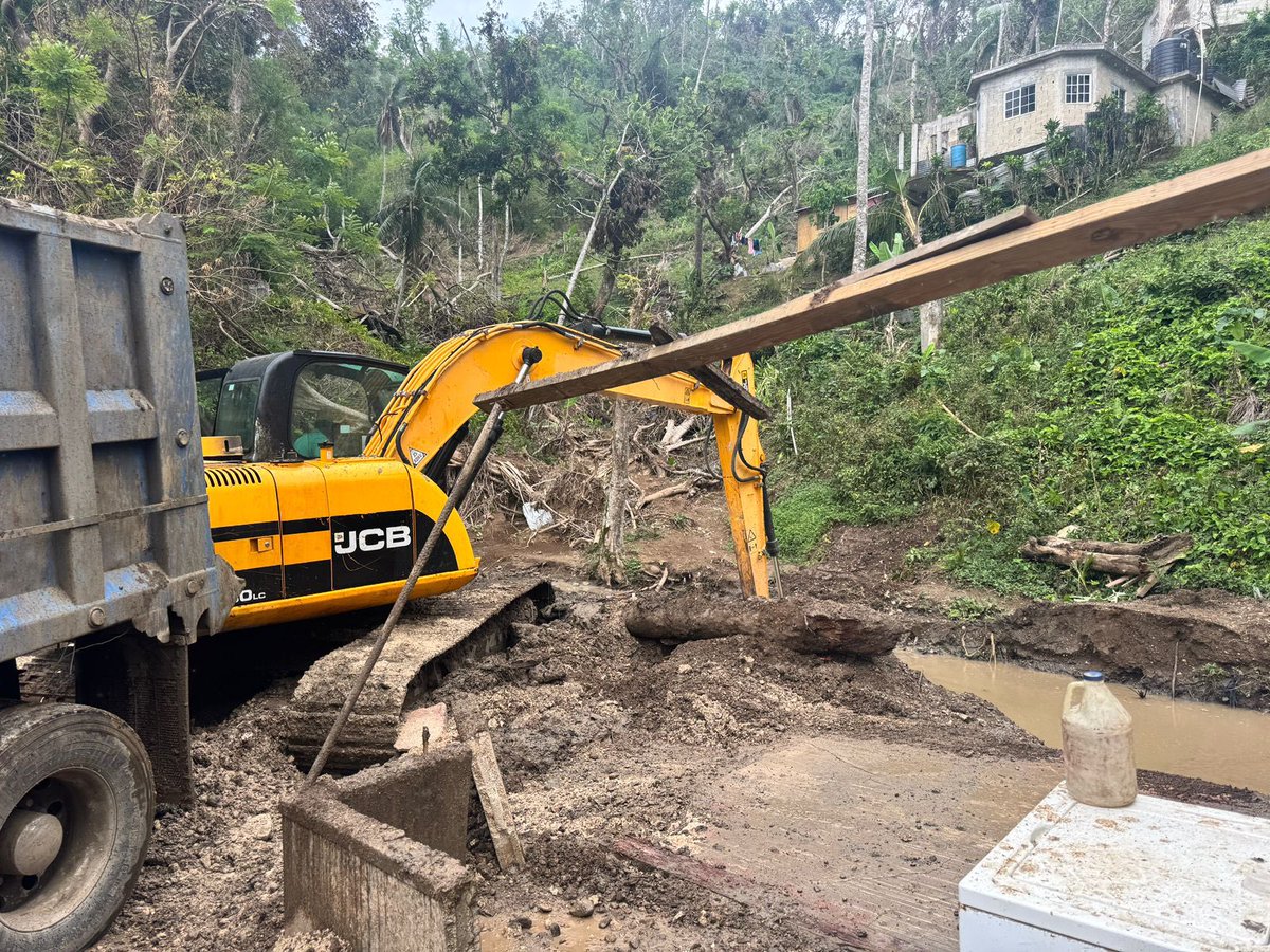 NestaJA's tweet image. Drain cleaning works are currently underway in John’s Hall, from Fairfield to Point. This river runs along the main road in John’s Hall and, regrettably, was the drain that claimed a life after the hurricane.