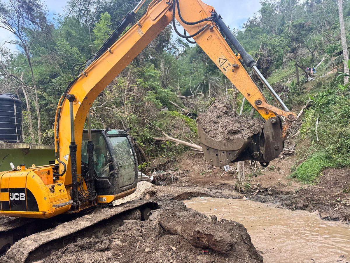 NestaJA's tweet image. Drain cleaning works are currently underway in John’s Hall, from Fairfield to Point. This river runs along the main road in John’s Hall and, regrettably, was the drain that claimed a life after the hurricane.