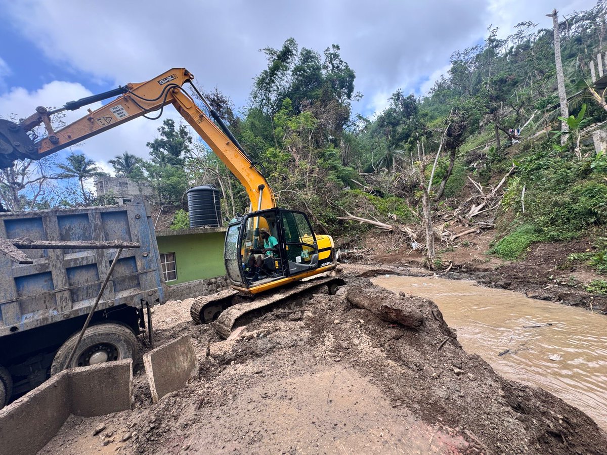 NestaJA's tweet image. Drain cleaning works are currently underway in John’s Hall, from Fairfield to Point. This river runs along the main road in John’s Hall and, regrettably, was the drain that claimed a life after the hurricane.
