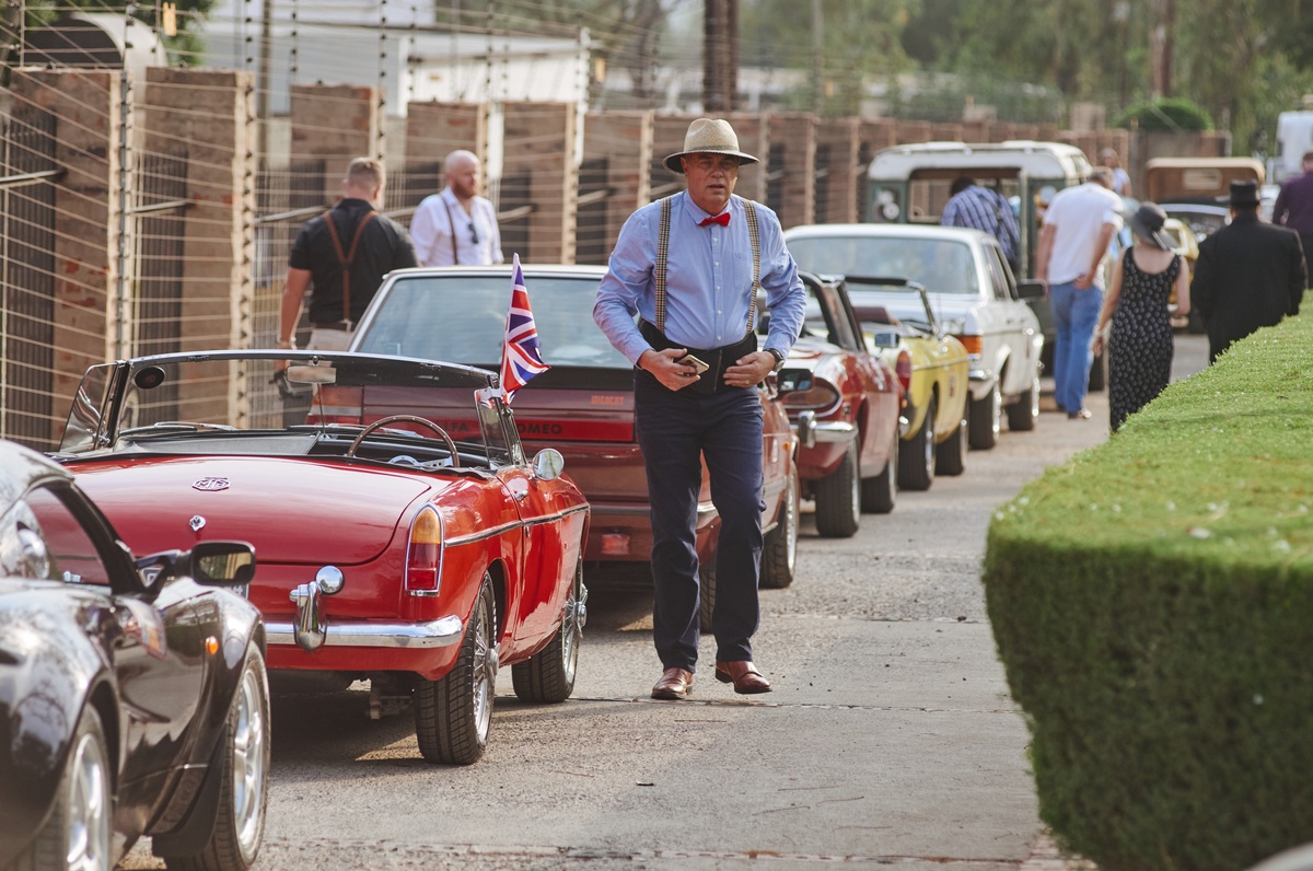 Bright red convertible, lined up with some serious classics and a gent straightening his bow tie – that’s Pretoria in all its dapper glory from last year. Get ready to join the drive, September 27th.

📸 Waldo Swiegers @watswaaijy  
🌎 South Africa, Pretoria