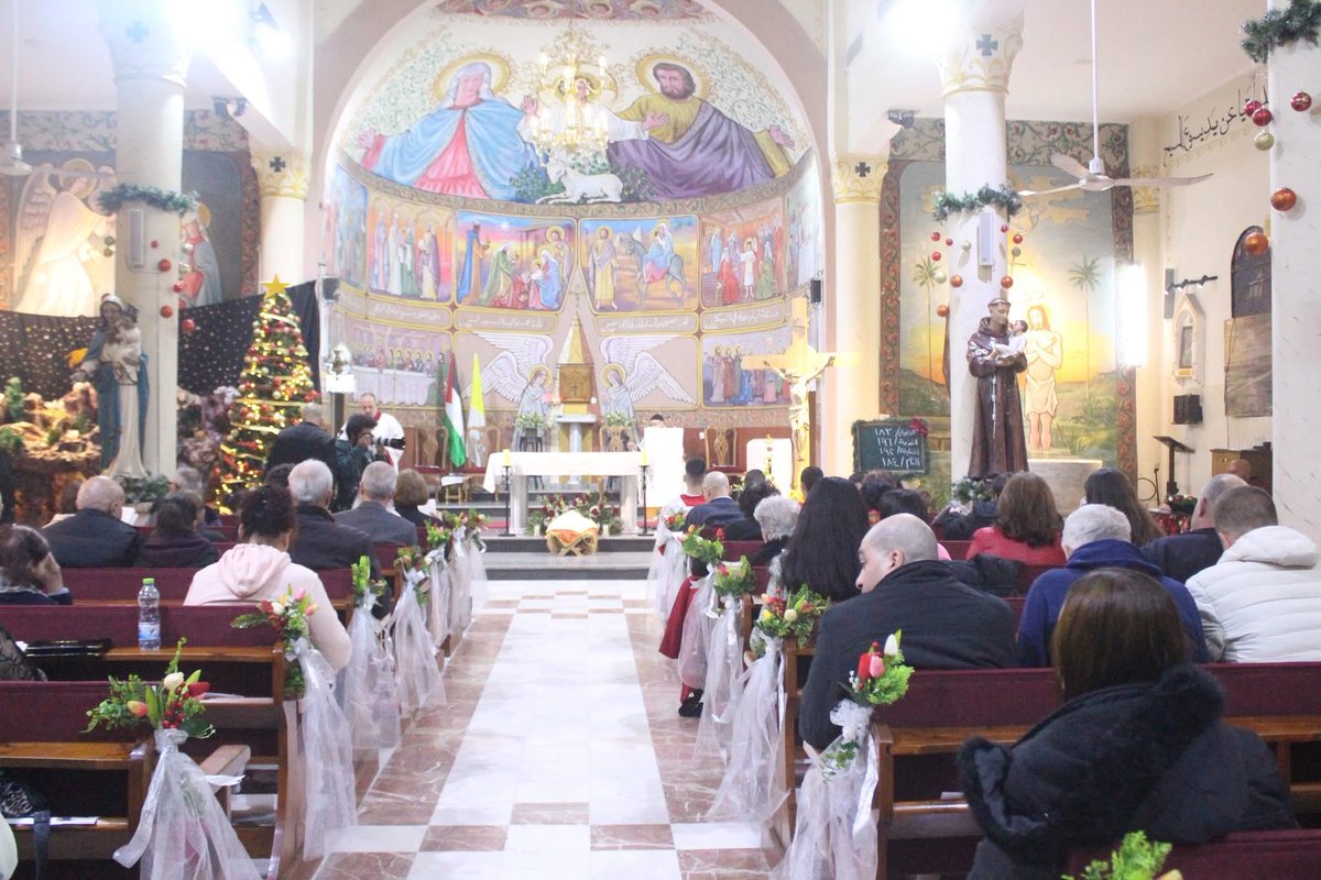 IhabHassane's tweet image. Midnight Christmas Mass at the Holy Family Catholic Church in Gaza City.