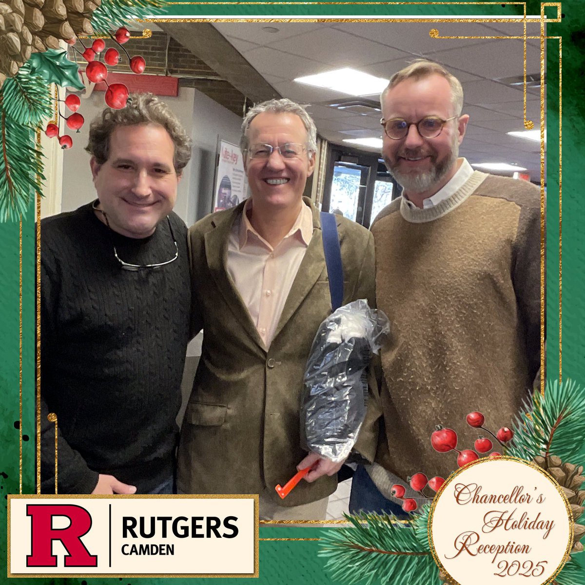 Rutgers Camden Holiday Party. Hanging with the Rutgers chancellor, a famous mathematician (Benedetto Piccoli) , two renown cognitive psychologists (Sarah Allred and Robrecht van der Wel)  and an existential psychologist (Andrew Abeyta). And me - a guy who mainly takes cat photos!