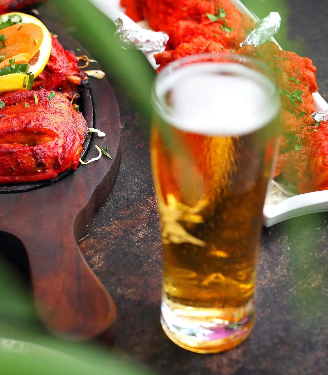✨Savor the char, sip the chill. Rupee &amp; tandoori chicken were made for each other! 🍻

#tandoorichicken #indianbeer #indianfood