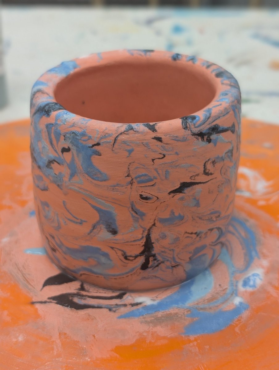 TechJeeper's tweet image. We did pottery tonight, like, from a clump of clay, on a spinning wheel.  I messed up once but my second attempt turned out great.  This is before it goes in the kiln.