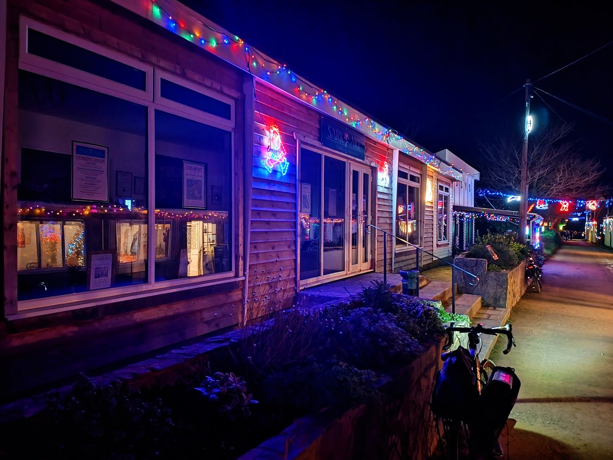 Sarkartgallery's tweet photo. #Christmas celebrations @Sark_Island are unique, the only time we have any "street lights"  on our #darkskyisland as The Avenue is lit up. Here's the gallery amid the Sark Tractor Run. Pop in Sat, Wed and Fri 2-4 for Christmas cards &amp; unique art gifts @Sark_Events @sark_stories https://t.co/0iwH3r03OX