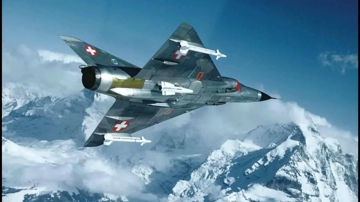 RealAirPower1's tweet photo. A Swiss Mirage IIIS slicing over the Alps. Spot the AIM-4 and AIM-9 loadout? Switzerland’s Mirages were uniquely modified to carry American missiles. https://t.co/BvuEiPyEIf