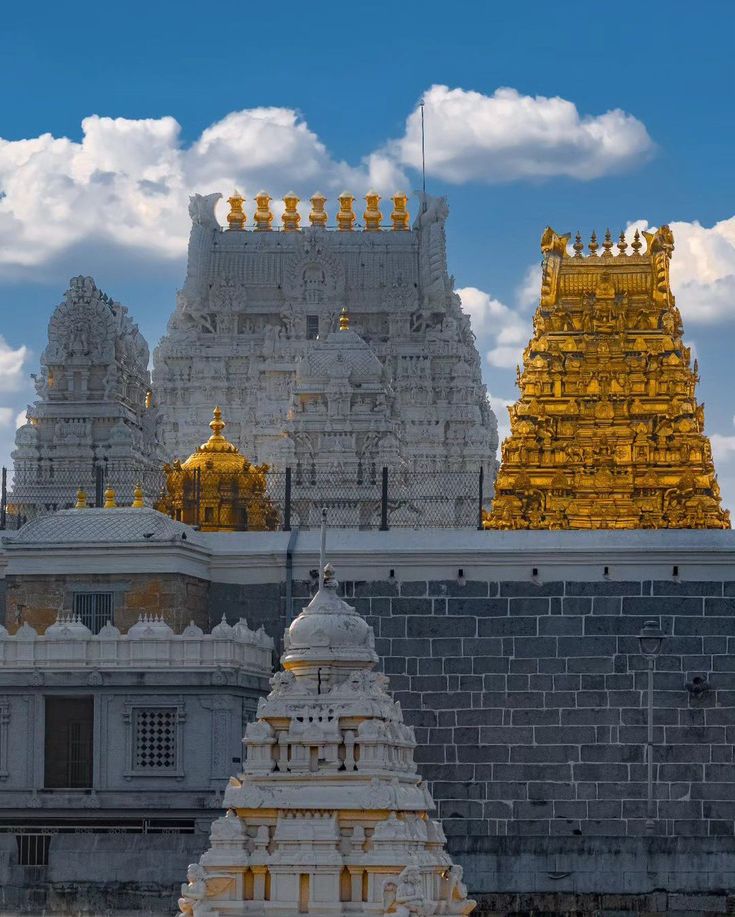 The divine contrast of white stone and pure gold under the vast blue sky.