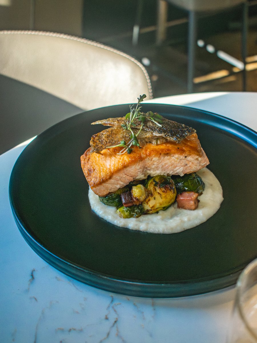 Where stories start and every moment feels a little brighter! Come join us, and see where the night takes you. ✨

ROASTED ORGANIC SALMON
Crispy Skin | Sunchoke Purée | Brown Butter Caper Emulsion | Bacon Fat Brussels