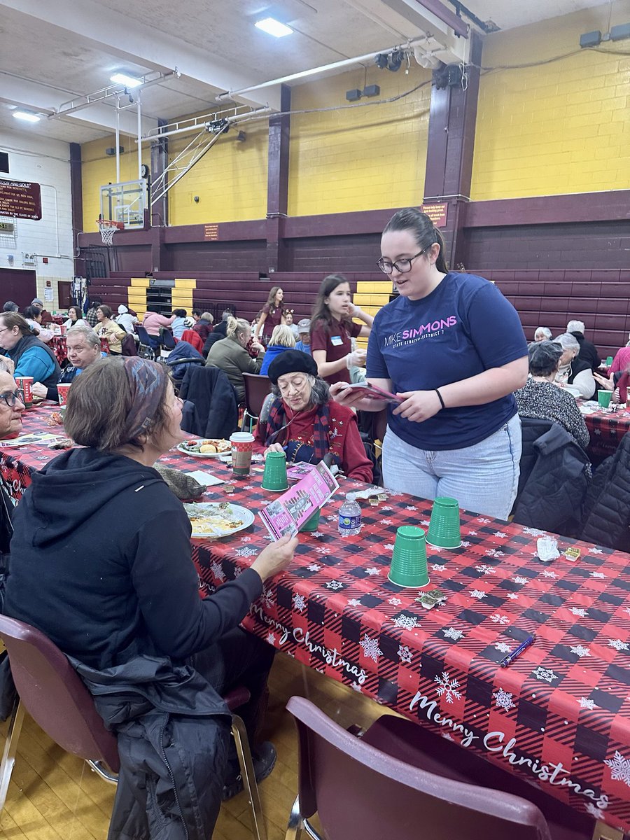 SenMikeSimmons's tweet photo. Happy Holidays, everyone! This morning the team took part in a beloved annual tradition - the St. Benedict Holiday Senior Luncheon! We loved talking with folks, handing out my Pink Mailer, and making sure everyone is connected to my office and state resources. (1/2) https://t.co/hrK1AVUv1S