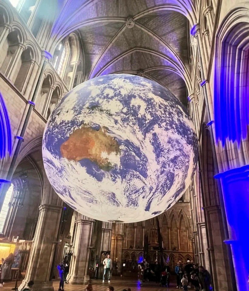 Hadley8512's tweet photo. Gaia 🌍 Luke Jerram’s breathtaking Earth sculpture, glowing inside a majestic cathedral ⛪ A powerful reminder of our planet’s beauty and fragility 💚🌿 Feeling awe and inspiration tonight at the Gaia exhibition 🌟🖼️ https://t.co/1YpiJMYebQ
