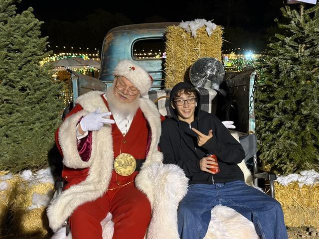 TravComer's tweet photo. My dude hangin with 🎅 crazy he used to sit on his lap… they get so big so quick… https://t.co/qDo94j3abb