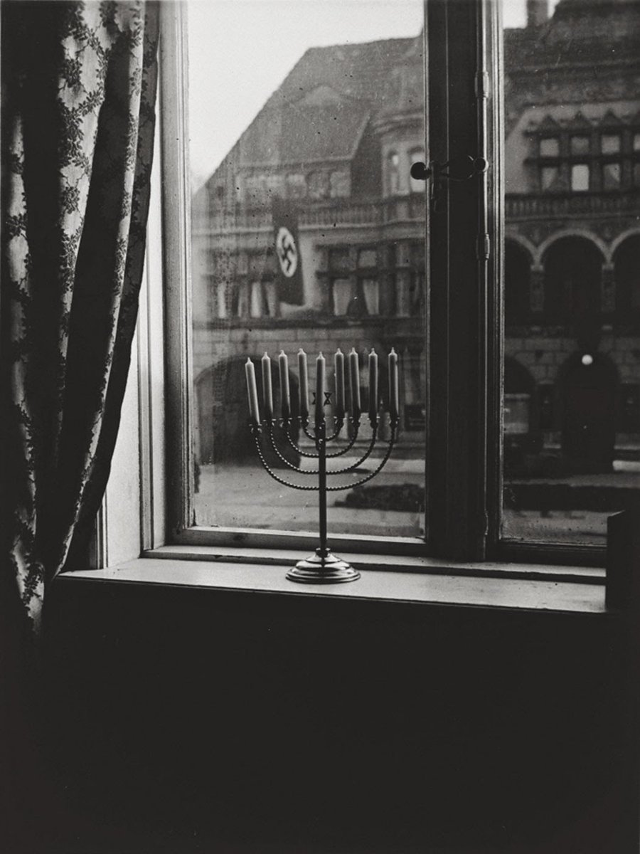 AlexEdelman's tweet image. I think of this photo a lot. The owner, Rachel Posner, donated it to Yad Vashem, and on the back wrote in German: “Chanukah 5692 (1932). ‘Death to Judah,’ so the flag says. ‘Judah will live forever,’ so the light answers.” Some lights cannot be extinguished. Chag Sameach.