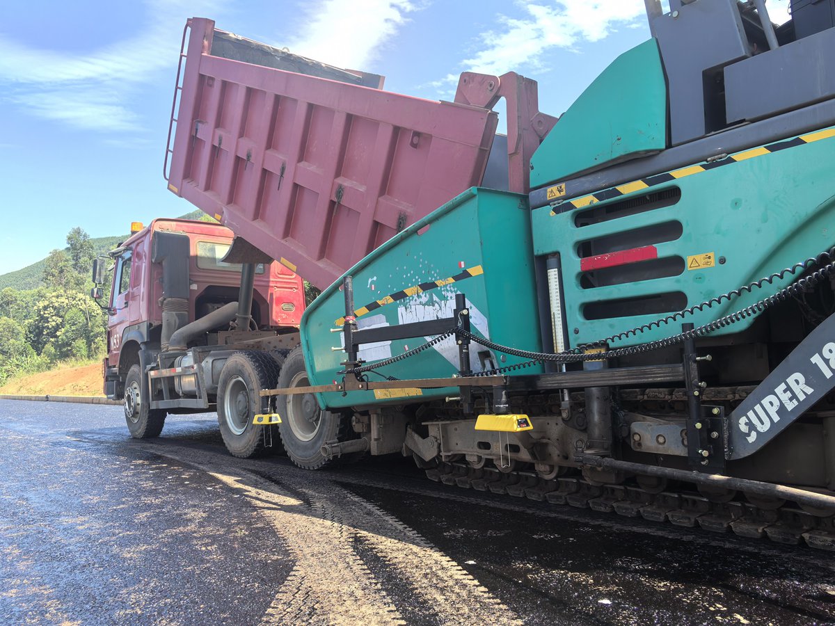 CRSGUganda's tweet photo. Kabaale International Airport Access Road,  asphalt paving started @MoWT_Uganda https://t.co/QSd5q6litt