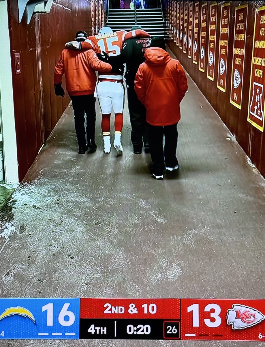 BBQChiefs's tweet image. Mahomes being helped off the field with a knee injury.