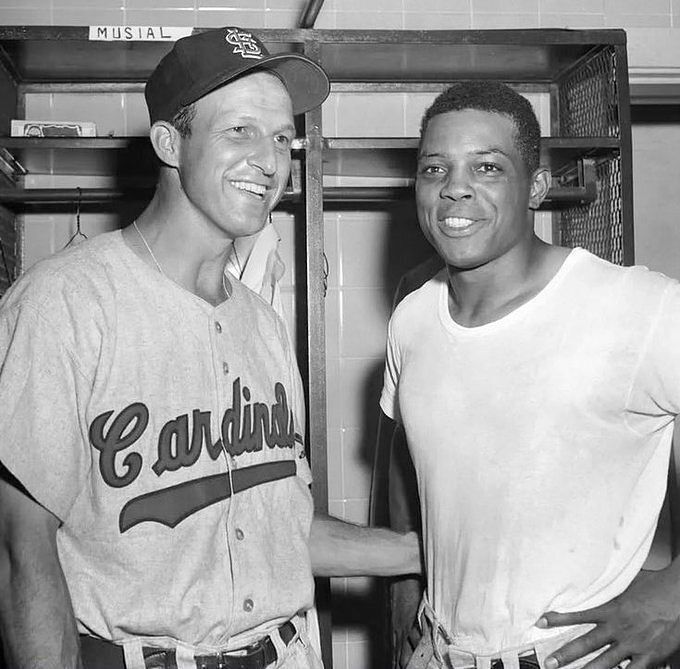 Stan Musial and Willie Mays in the locker room at the 1956 All Star Game. 1135 HRs and 6923 hits in their combined careers.