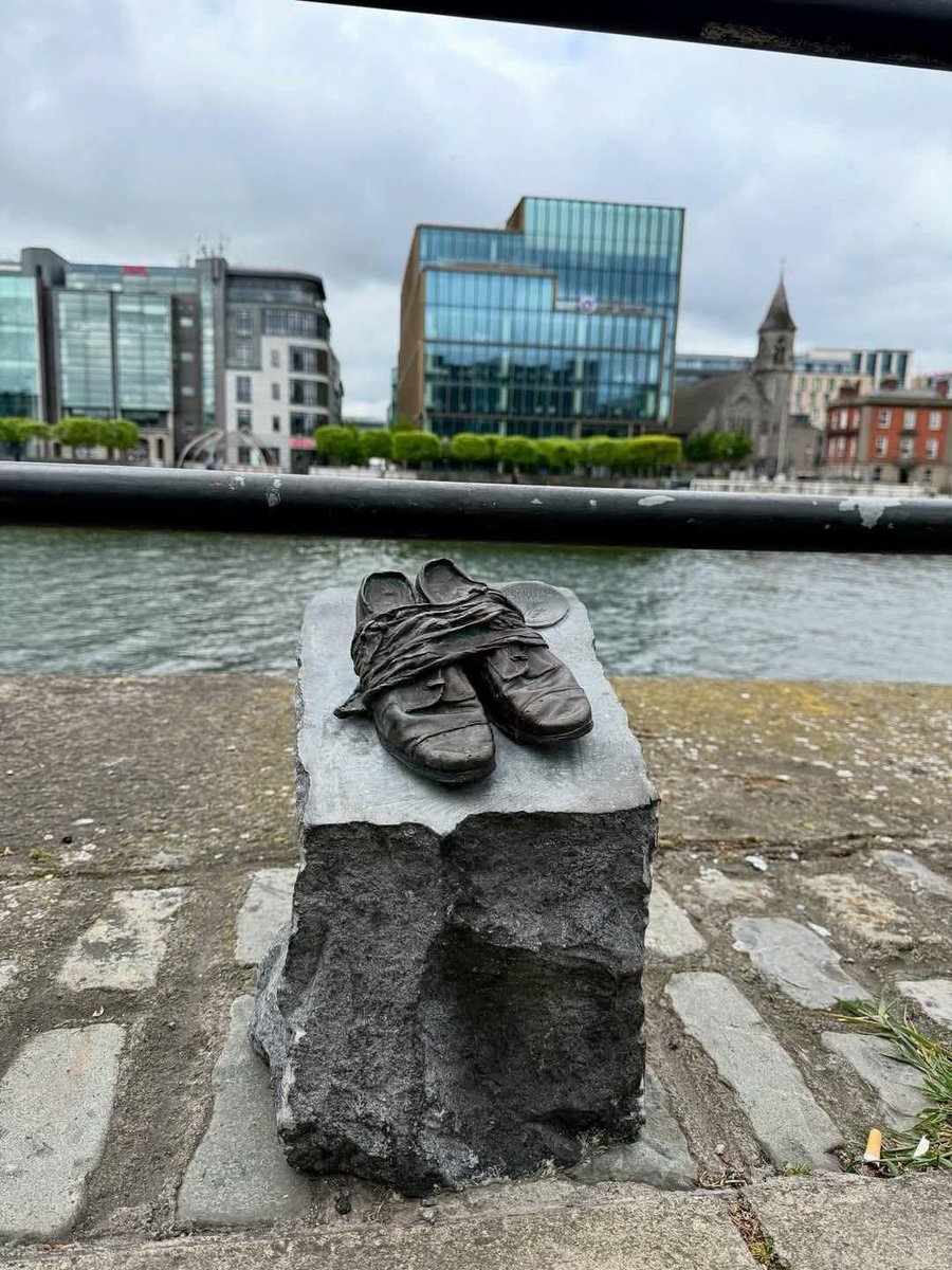 Bronze shoes which are part of the National Famine Way trail in Ireland

The trail commemorates the forced emigration of Irish people during the Famine (1845-1849)

The shoes are cast from a real pair of children's shoes found bound together in a 19th-century cottage roof