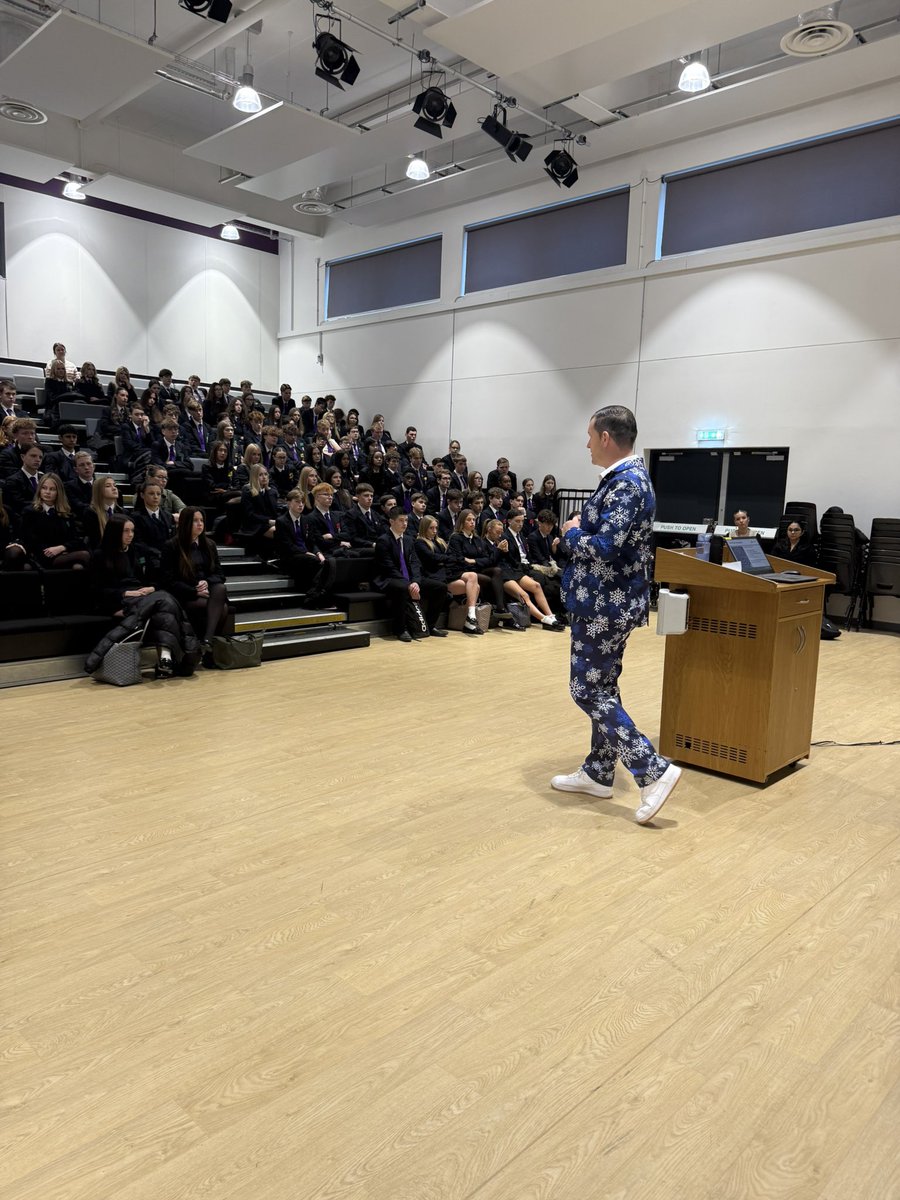hallmead's tweet photo. A serious Year 11 assembly this morning in advance of results and predicted grades being published tomorrow. 

The message was delivered in a Christmassy way though by Mr Leslie! 

Day 1 of his 5 Christmas suits 🎄🎄🎄🎄

@elatrust @HallMeadPastor1 @MattDronfield https://t.co/ebuoRyU8TL