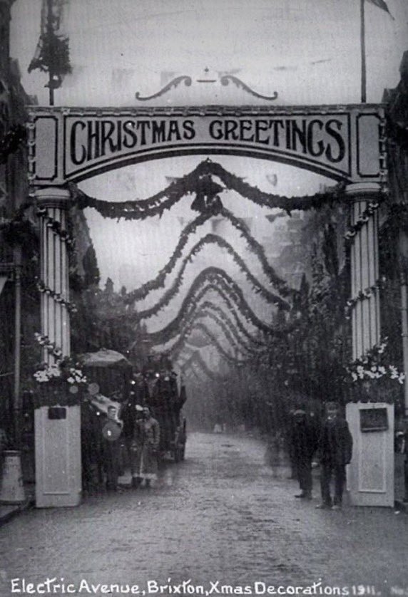 The_East_End's tweet photo. This is how Christmas decorations USED to look like in the streets! This is Electric Avenue in Brixton in 1908 and 1911 respectively, and puts todayโs often meagre offerings in the shadeโฆ #london #history #christmaspast https://t.co/ekPluw79Ws