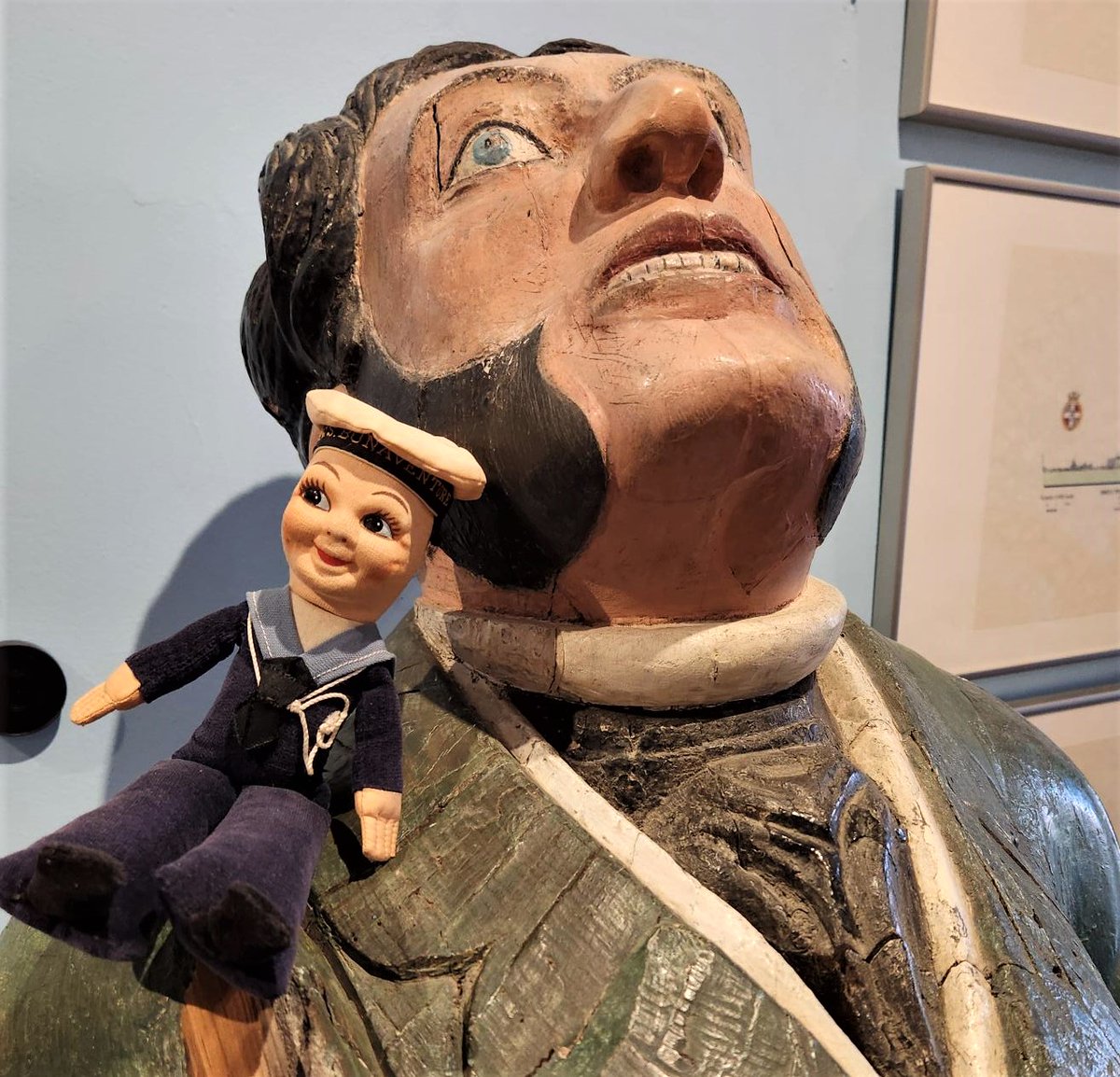 NavalMuseumHFX's tweet image. #holidayfun- Over the weekend Bobby made a friend! The ship figurehead from HMS URGENT sits alone in the second floor foyer. Bobby was found hanging out with him this morning as the staff turned on the exhibit lights.