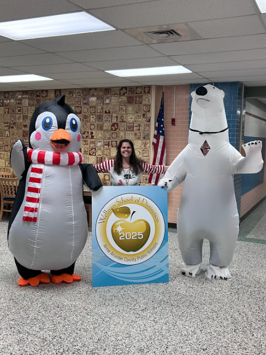 AACPSComSchools's tweet photo. Exciting News! Monique Jackson visited Overlook ES last week to present us with the Wellness School of Distinction award!  Here’s the Principal with some wintery friends celebrating this special moment.  @AACountySchools #BelongGrowSucceed #CommunitySchools #AACPSCommunitySchools https://t.co/zd9SYgS2Oq