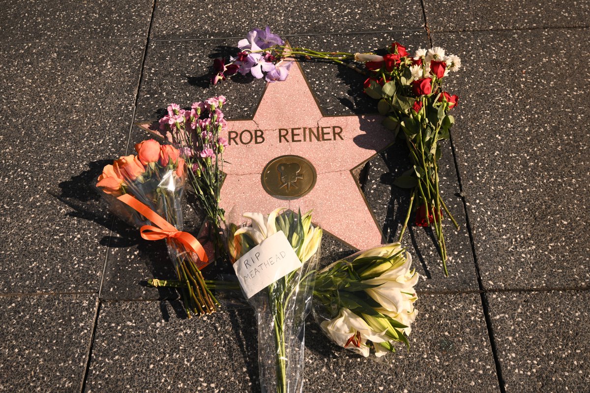 Rob Reiner's star on the Hollywood Walk of Fame is adorned with flowers as  grieving fans pay tribute to the iconic director.