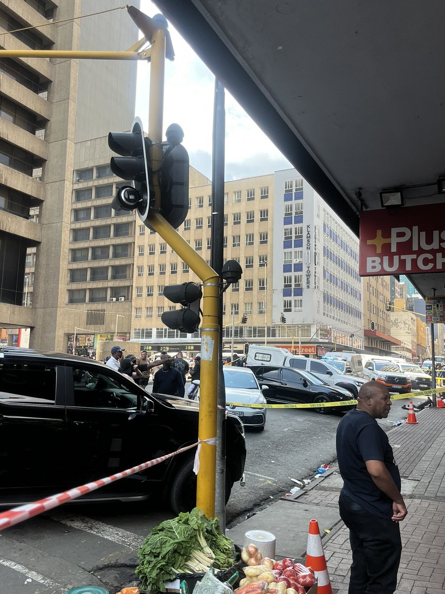 Forensic services combing through the scene where popular Dj was shot and killed just outside Carlton Centre in the Johannesburg CBD #SABCnews