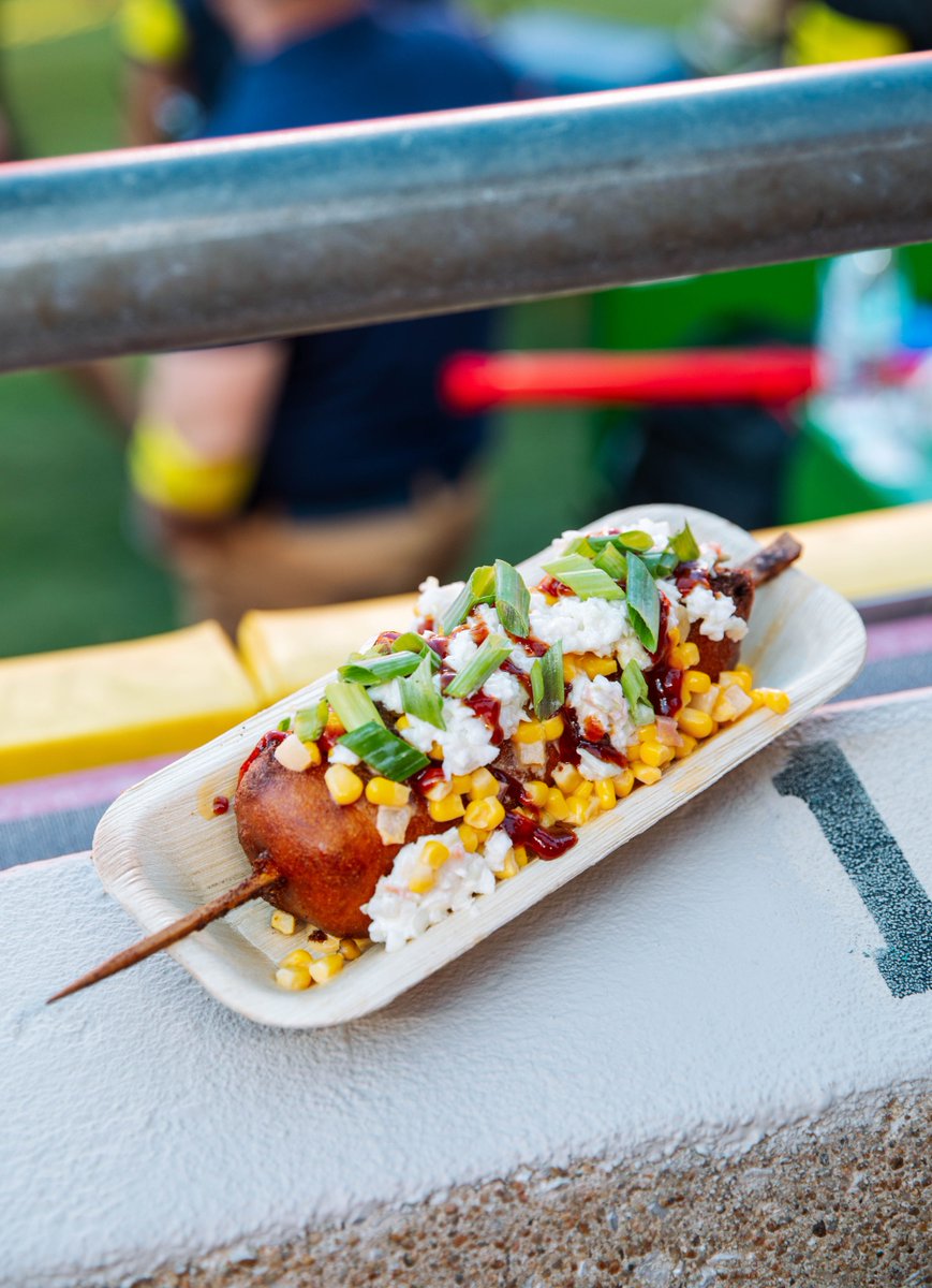 BBQ Pit on a Stick? Yeah, we’re living right. Brisket, cornbread batter, cheesy corn and slaw… basically the whole cookout, minus the plate. Find it at Burger Kitchen in sections 102 and 116!