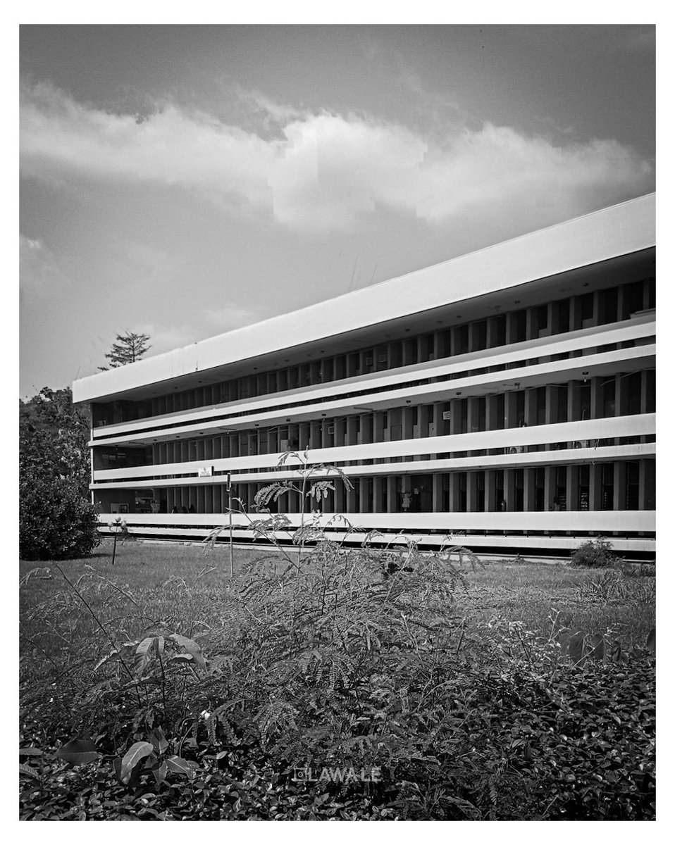Against the sun, the building tells its story: continuous horizontal slabs offer deep, unwavering shade, while a rhythmic line of vertical fins guards the cool recess within.
.
Agric Lecture Theater 
.
OAU - DECEMBER 2025