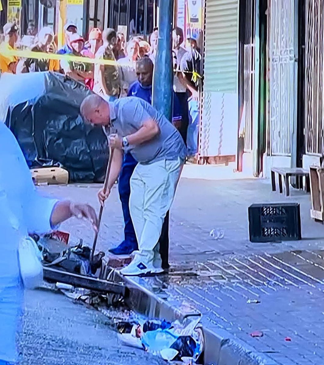 The family members here are seen cleaning up the floor where DJ Warras was shot, he was approached just after parking his car in Joburg CBD by 3 guys who then shot at him and ran away. He was there inspecting building where his security company is guarding.

DJ Warras
