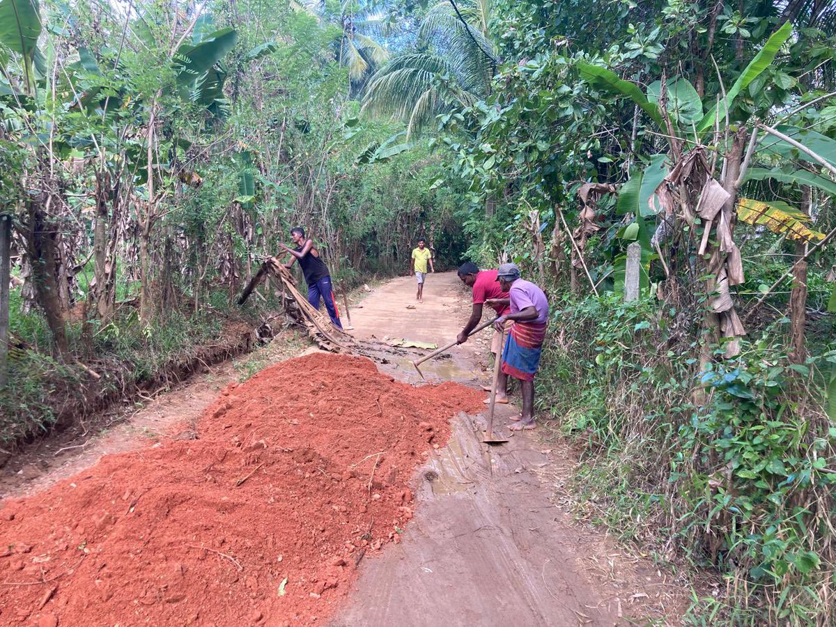 UNDPSriLanka's tweet photo. Turning recovery into resilience. 
In Rideegama Pradeshiya Sabha, early recovery efforts are underway together with Local Authorities with support from the @UNDP led, @theGEF funded Chemical and Waste Project. Soil from recent landslides is being safely reused for flood-damaged road reconstruction—restoring access while promoting sustainable resource use.

#EarlyRecovery #SriLanka #CycloneDitwah