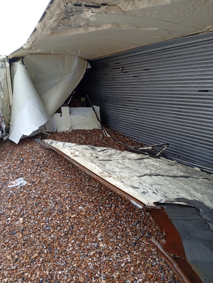 Stricken shipping container on Bognor Regis beach.