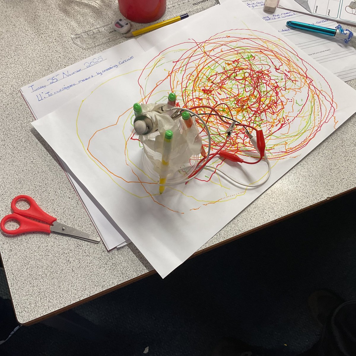 Year 5 have been making doodlers in DT. They made a circuit using batteries, wires and motors and added them to a cup with felt tips. They then added an off-centre weight to make the cup wobble and created doodles and patterns on the paper. They then evaluated their doodlers.
