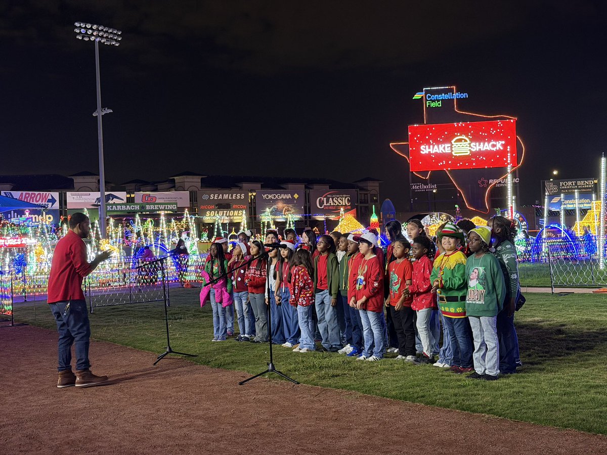 HREMustangs's tweet photo. Our choir, led by Mr. Randle, performed at Constellation Field as part of Sugar Land Holiday Lights, bringing festive music to the community. #HREProud
#HolidayPerformance @FortBendISD https://t.co/T36UIi0wz7