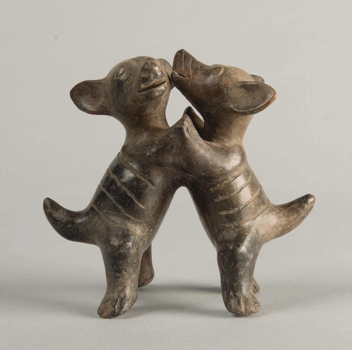 archaeologyart's tweet image. Dancing dogs. Culture: Colima (Comala). Place of origin: West Mexico. Date: c. 200 BC–AD 200. Medium: Blackware ceramic (with slip). Collection: Princeton University Art Museum.⁣