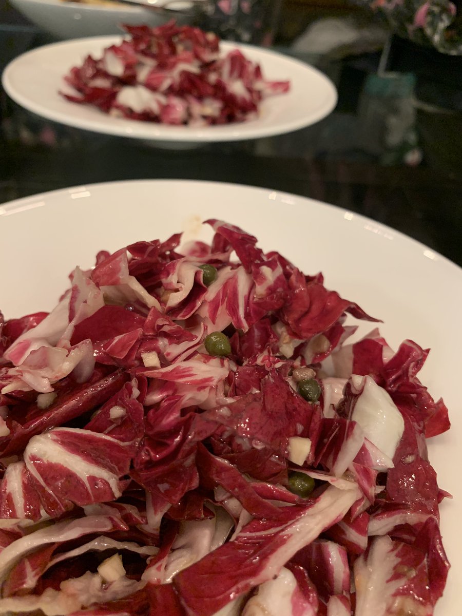 Tonight’s cappellacci are filled with ricotta (and a little parm and nutmeg) and tossed with caramelized radicchio, walnuts, and blue cheese. Served with raw radicchio salad dressed with anchovies, garlic, and capers.