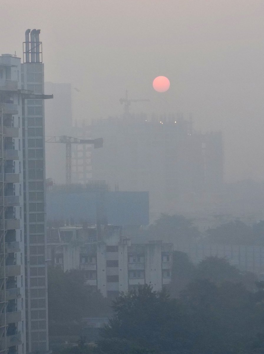 December morning in Delhi. the sun is but a hint of orange peeping through the haze.