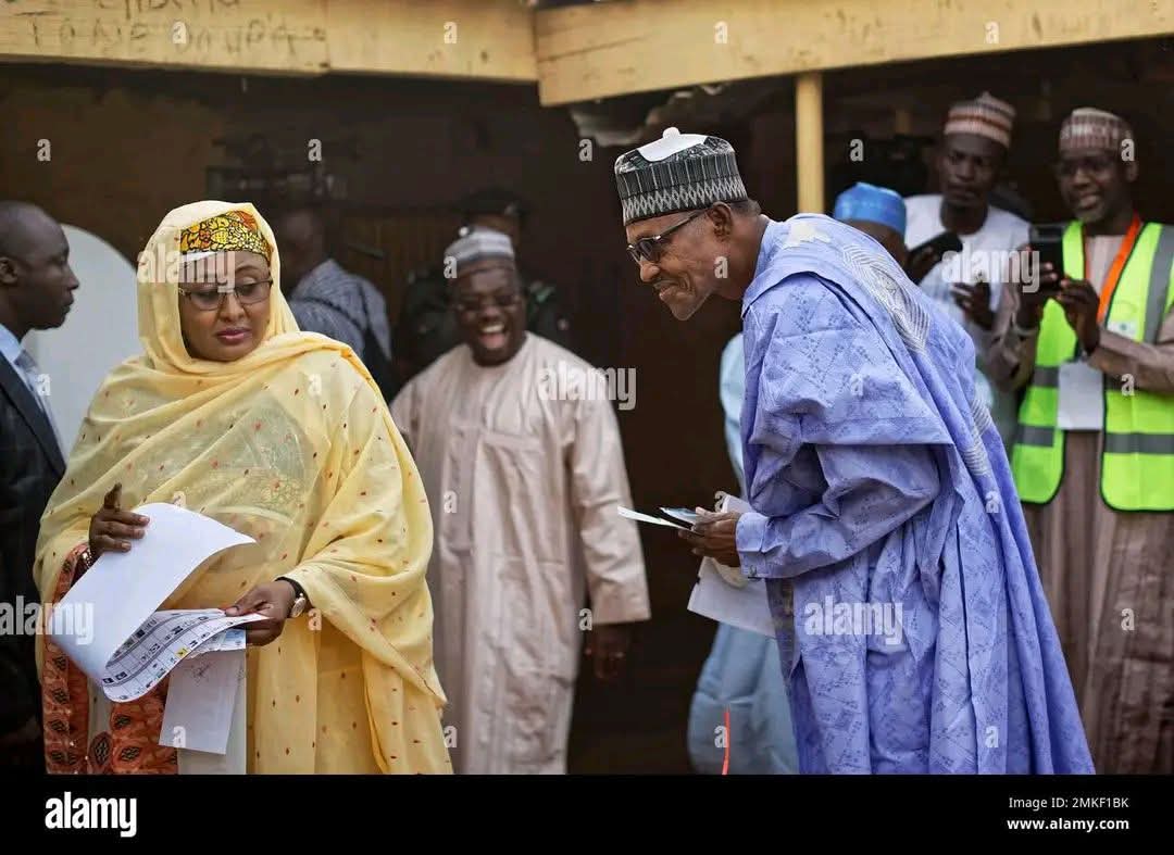Balancing242's tweet image. Late Buhari checking the ballot paper to be sure his wife didn't vote against him in 2019