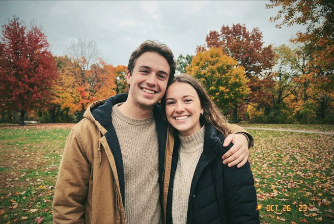 Prompt: a faithfully illustrated Christmas card design featuring the couple in Christmas hats, and t