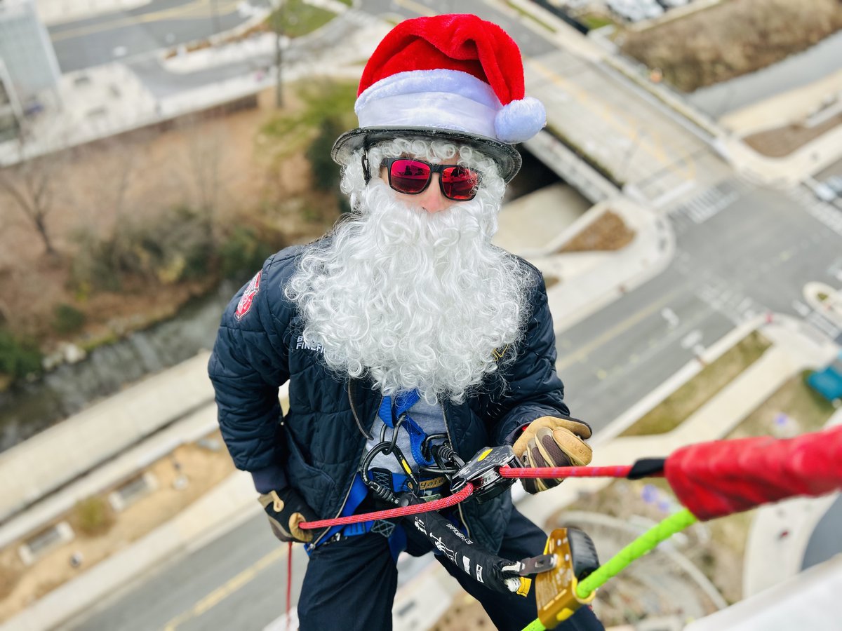 The rappels were heroic. The reactions were unforgettable.

Twelve stories above the ground, Charlotte Firefighters leaned over the edge of Levine Children’s. Dressed as Santa, elves, and the Grinch, they weren’t there to respond to an emergency. They were there to deliver joy.