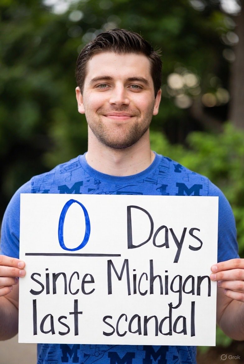 Michigan fans making signs for their sporting events.