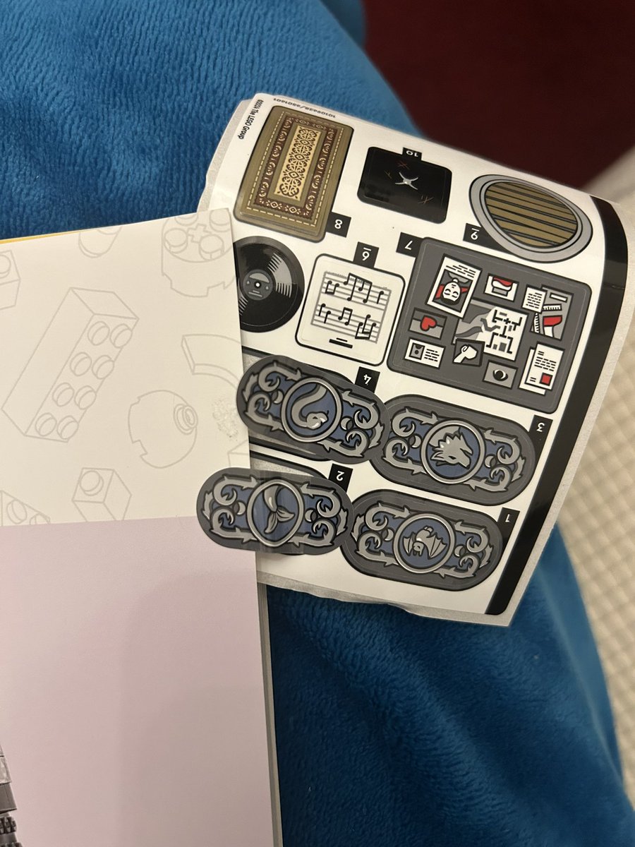 beth_bourbage's tweet photo. @LEGO_Group bought my daughter a Lego set for Christmas but the stickers were stuck to the manual. Can we get replacement stickers? There’s paper on the back of them now so they won’t stick. https://t.co/Z60SH1zQj4