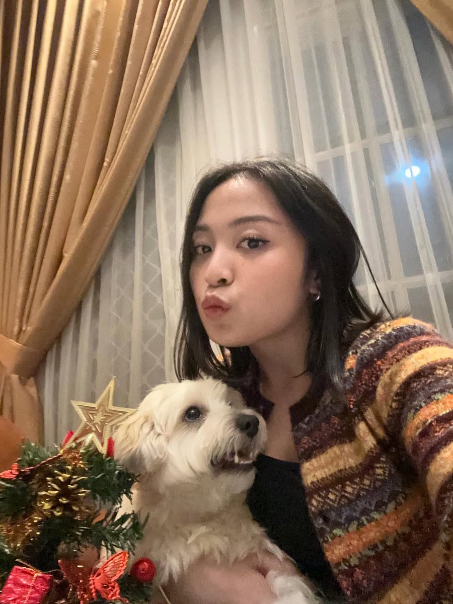 Bernadya and her dog stun for Christmas Eve.