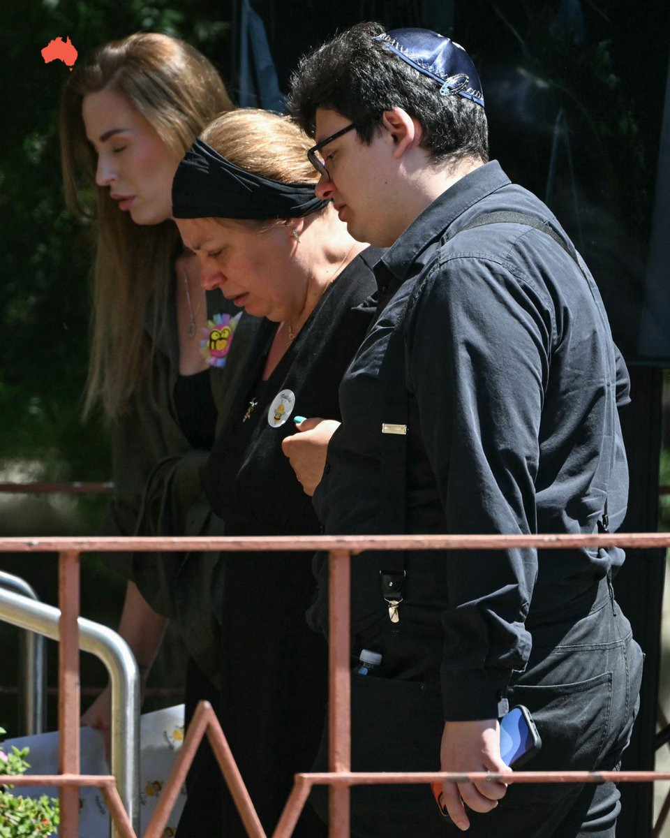 australian's tweet photo. "Make sure she doesn’t just remain in our hearts, in our memories, in our minds … but she needs to remain alive in our deeds. How we live our lives.” 🐝
The youngest victim of the Bondi Beach terrorist attack has been farewelled at her funeral. Matilda is affectionately known by her family as Matilda Bee.
Her parents Valentyna and Michael moved to Australia from Ukraine, and named her “Matilda because she was our firstborn in Australia ... Matilda was the most Australian name that could ever exist.”
Mourners, police officers, even journalists reporting on the funeral wore stickers with a picture of a cartoon bee and Matilda’s name. Others carried balloons in the shape of bumble bees, while cars were also embellished with bee stickers.
Pictures: Glenn Campbell / John Appleyard / NewsWire / AFP / AP
Follow live updates: https://t.co/HUapyl0UFf