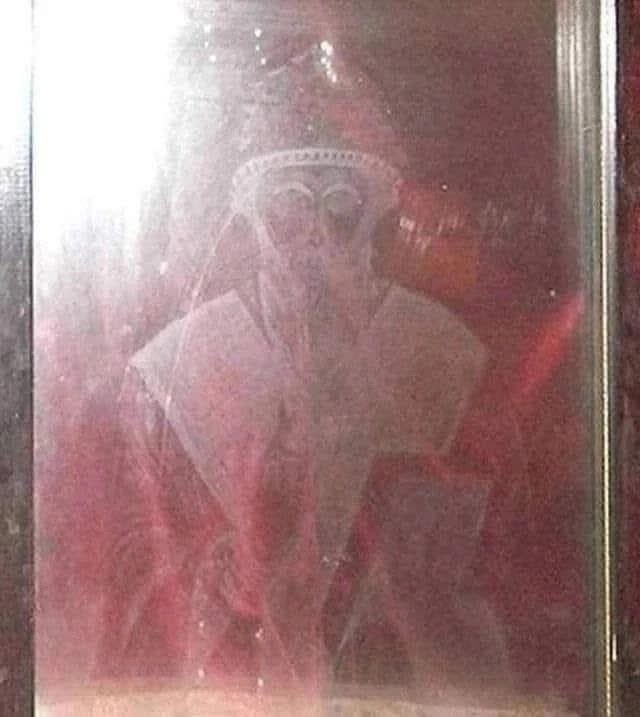 FChristopher77's tweet photo. The Image of Saint Spyridon appeared on a stained glass window.

In the Greek Orthodox Monastery of Saint Spyridon of Trimythous, located in the Christian Quarter of Jerusalem (in the Old City, near the Damascus Gate), an icon of the saint, measuring 70 x 50 cm, half painted at the end of the 19th century and restored about 50 years ago, miraculously appeared on a window on June 2, 1994.

Hieromonk Sofronie, the abbot of the monastery at that time, became seriously ill. He was on the verge of calling his spiritual children to say goodbye.

Then Saint Spyridon suddenly appeared to him and told him that he would not die yet, but would live for a few more years. And with these words, he departed - not through the door, but through the window.

The illness receded, and Hieromonk Sofronie was healed by the saint and served in the monastery for another approximately ten years, until his time came - and he went to the Lord.

Some time after the miraculous visit, Hieromonk Sofronie noticed that the window had darkened. He looked more closely and saw that Saint Spyridon was imprinted on the glass! His face, his vestments - everything was exactly like on the icon.

This impression has remained on the glass. It is now preserved in a special icon case as a great relic. The miraculous icon is framed with dark crimson velvet. The face is best seen when viewed at an angle of about 30 degrees.

Saint Spyridon pray to God for us!