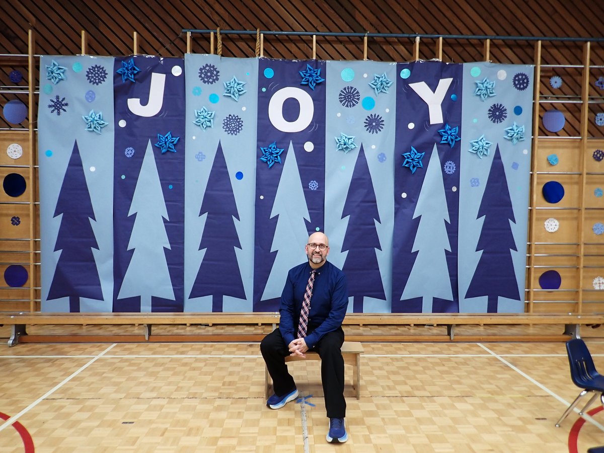GeofferyKehrig's tweet photo. Backdrop I designed for our elementary school winter concert. Students sounded amazing & created a joyous event for their families. I'm wearing #RedforBCEd in my tie because I care about public education, working conditions for teachers & learning conditions for our students. https://t.co/P79R8RTjgH