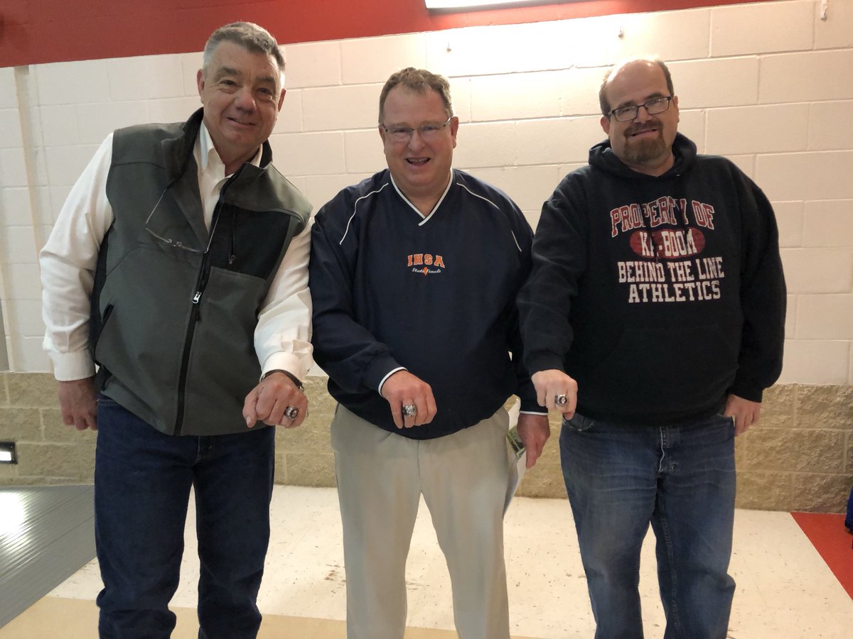 tvfarmer's tweet photo. Honoring Coach Vic Binkley with his  800th victory as Clinton beat Riverton.  Here I am with the late Todd Yokley showing our Hall of Fame rings.  Coach Binkley submitted our names to the Illinois Coaches HOF a few years back. Classy guy who didn’t have to do it. https://t.co/NZNbppFFYx