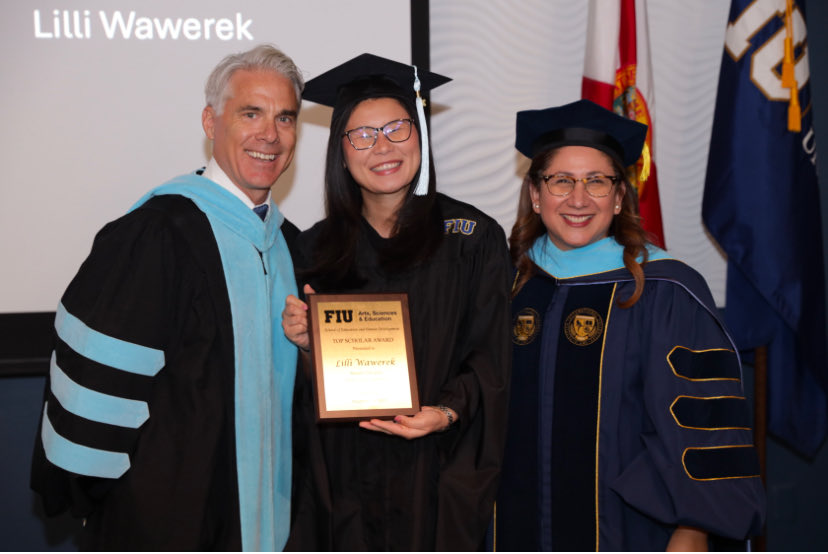 Recognizing our Top Scholar during the 2025 Educational Leadership Hooding Ceremony for our online Masters students.