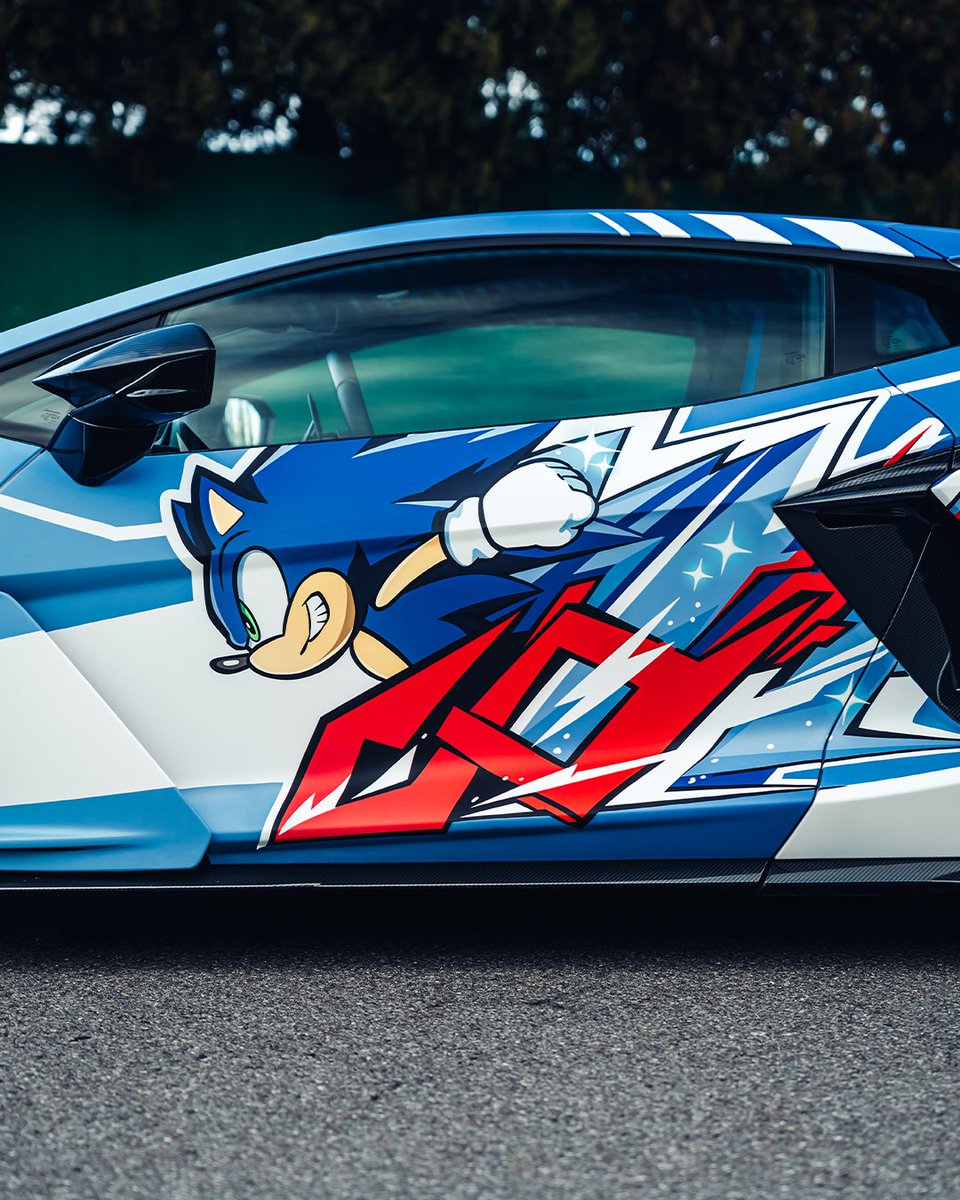 Lamborghini's tweet image. Lamborghini Revuelto rocked a special livery inspired by Sonic the Hedgehog at Imola Comics and Games. The ultimate fusion of speed and pop culture is complete!