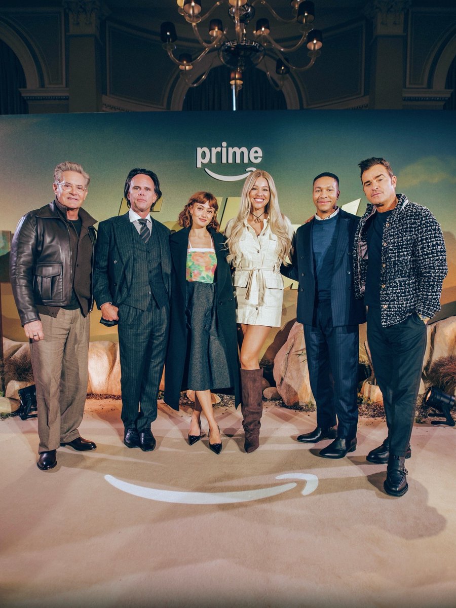 A photo of television host Elle Osili Wood with Kyle MacLachlan, Walton Goggins, Ella Purnell, Aaron Moten, and Justin Theroux, the stars of Amazon series Fallout.